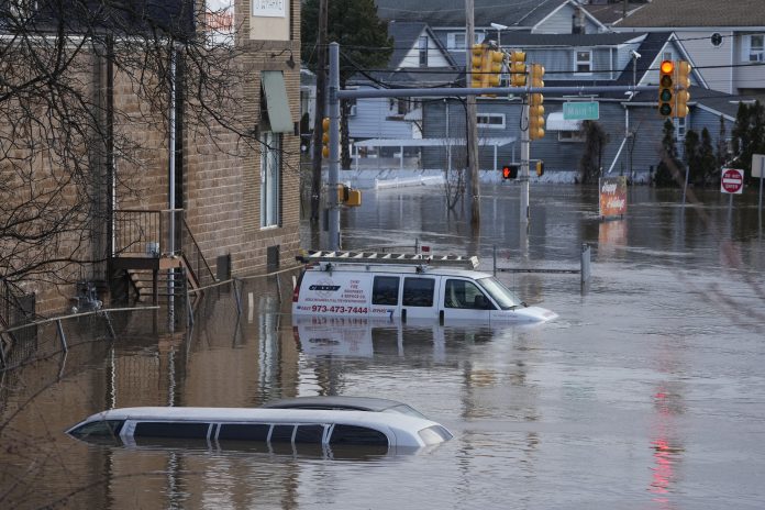 East Coast residents struggle with flooding and power outages after storms ripped across the US