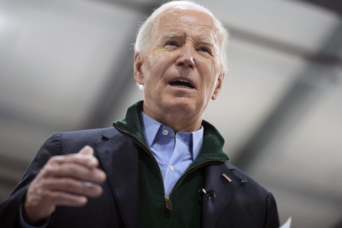 President Joe Biden speaks while visiting firefighters at the