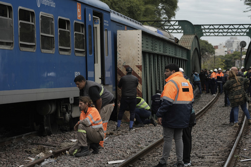 A train in central Buenos Aires strikes a boxcar on the track, injuring dozens