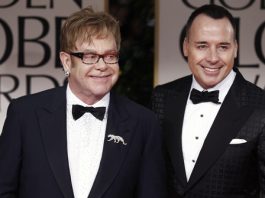 Elton John, left, and David Furnish arrive at the 69th Annual Golden Globe Awards