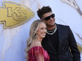 Kansas City Chiefs quarterback Patrick Mahomes and his wife Brittany arrive on the red carpet before a ceremony for team members to receive their championship rings for winning NFL's Super Bowl 58 football game Thursday, June 13, 2024, in Kansas City, Mo. (AP Photo/Charlie Riedel)