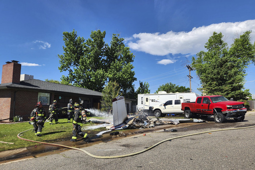 4 hospitalized after small plane crashes in suburban Denver yard after trying to land on street