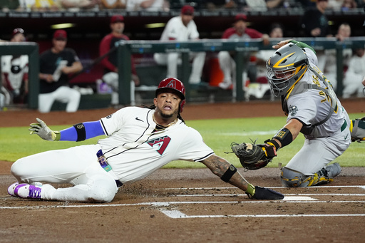 Athletics rally late, snap 11-game road losing streak by beating Diamondbacks 9-4