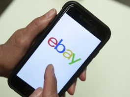 FILE - An eBay app is shown on a mobile phone, July 11, 2019, in Miami. (AP Photo/Wilfredo Lee, File)