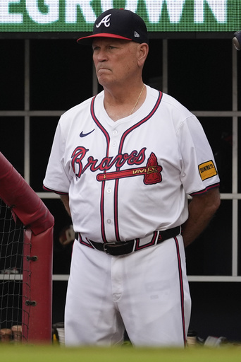 Braves manager Brian Snitker smiles 1 day after being hit below the belt by a foul ball