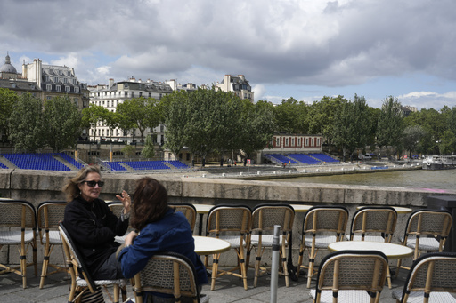 An American swims in Paris’ Seine River before the Olympics despite contamination concerns