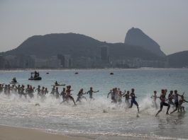 FILE Competitors enter the waters of Copacabana beach during the men's triathlon event of the 2016 Summer Olympics in Rio de Janeiro, Brazil, Thursday, Aug. 18, 2016. (AP Photo/Felipe Dana, File)