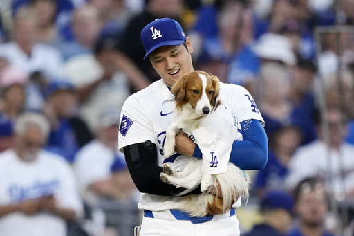 Ohtani hits home run and steals 2 bases in Dodgers’ 6-4 victory against Orioles, also throws first pitch with his dog