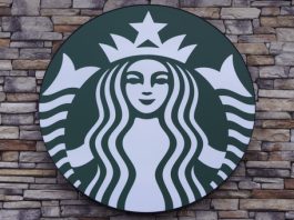 FILE - A Starbucks mermaid logo sign is displayed on a store, May 29, 2024, in Salem, N.H. (AP Photo/Charles Krupa, File)