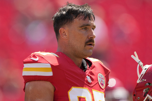 Kansas City Chiefs tight end Travis Kelce (87) warms up before an NFL preseason football game against the Detroit Lions Saturday, Aug. 17, 2024, in Kansas City, Mo. (AP Photo/Charlie Riedel)