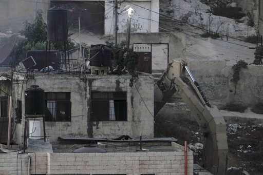 Israeli soldiers are accused of pushing three unconscious bodies off rooftops during a raid in the West Bank