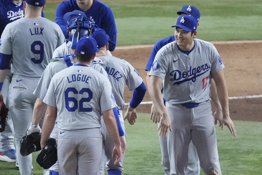 Ohtani hits 3 home runs, drives in 10 runs, and makes history as Dodgers defeat Marlins and secure playoff spot