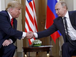 FILE - President Donald Trump, left, and Russian President Vladimir Putin shake hands at the beginning of a meeting at the Presidential Palace in Helsinki, Finland, July 16, 2018. (AP Photo/Pablo Martinez Monsivais, File)