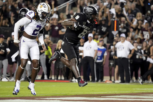 Reed leads comeback with 3 second-half touchdowns as No. 14 Texas A&M defeats No. 8 LSU 38-23