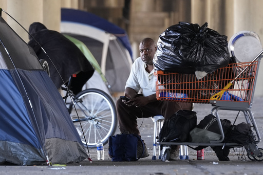 Prior to Taylor Swift’s concert in New Orleans, a homeless camp is relocated.