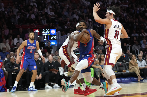 Butler nets 23 points, Rozier contributes 20 as Heat surge ahead in the final quarter to defeat Pistons 106-98.