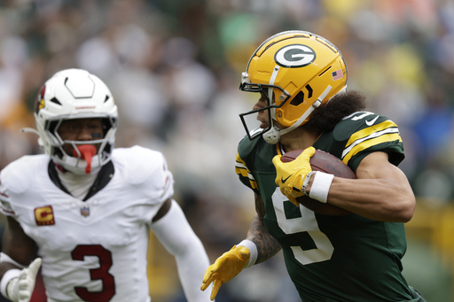 Doubs grabs 2 touchdown catches in return from suspension, leading Packers to a 34-13 victory over Cardinals