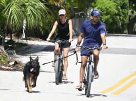 SURFSIDE, FL - JULY 14: Joaquim Valente and Gisele Bündchen are seen on a bike ride on July 14, 2024 in Surfside, Florida. (Photo by MEGA/GC Images)