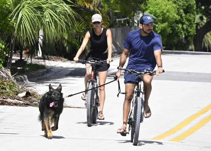 SURFSIDE, FL - JULY 14: Joaquim Valente and Gisele Bündchen are seen on a bike ride on July 14, 2024 in Surfside, Florida. (Photo by MEGA/GC Images)