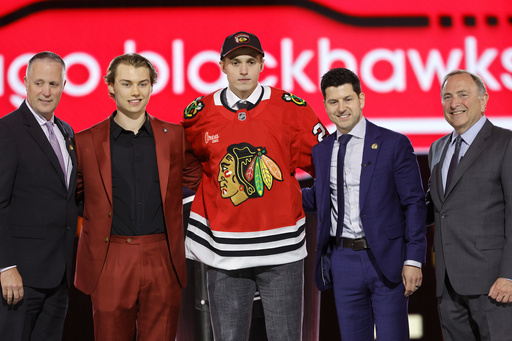 Blackhawks bring up defenseman Levshunov and send their second overall draft pick to the minor leagues.