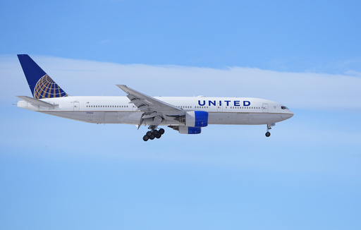 United Airlines reports a 15% decrease in third-quarter profits, though revenue trends show improvement.