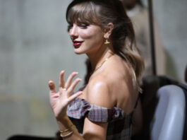 Taylor Swift arrives before the start of an NFL football game between the Kansas City Chiefs and the New Orleans Saints Monday, Oct. 7, 2024, in Kansas City, Mo. (AP Photo/Charlie Riedel)