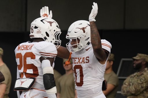 Quinn Ewers passes for three touchdowns as No. 5 Texas defeats No. 25 Vanderbilt 27-24