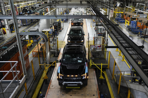 Ford’s quarterly earnings fall nearly 26% after $1 billion in write-offs for discontinued electric SUV project.