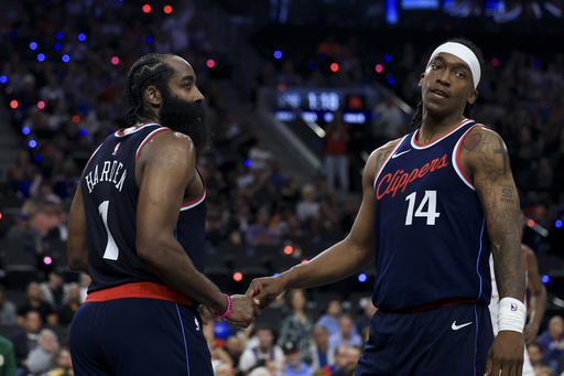 LA Clippers guard James Harden, left, celebrates his and-one foul with guard Terrance Mann during the first half of an NBA basketball game against the Phoenix Suns, Wednesday, Oct. 23, 2024, in Inglewood, Calif. (AP Photo/Ryan Sun)