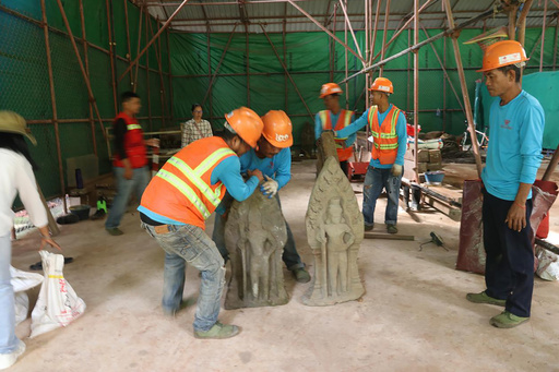 Archaeologists in Cambodia uncover twelve ancient sandstone sculptures at the Angkor UNESCO heritage site.