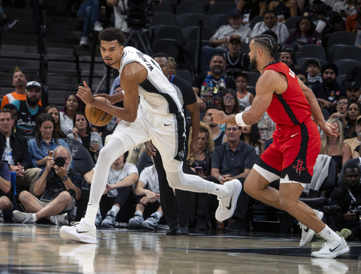 Wembanyama and Sochan lead Spurs to narrow victory over determined Rockets in home opener, 109-106.