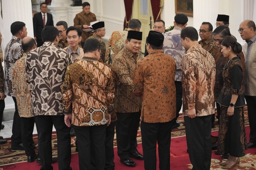 Indonesia’s newly elected president unveils the largest Cabinet in the nation’s history.