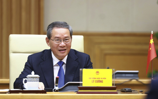 Chinese Premier discusses trade in Vietnam amid South China Sea tensions.