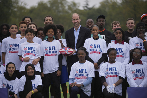 Prince William participates in flag football with children during NFL event in London