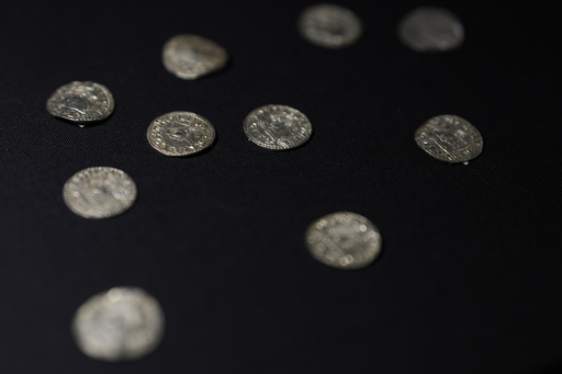 Treasure of ancient coins, dating back a thousand years, discovered in a farmer’s field fetches $5.6 million at auction.