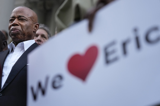 NYC mayor deflects questions about bribery charges as a potential witness speaks outside City Hall