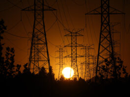 FILE - The sun sets behind high tension power lines on Sept. 23, 2024, in the Porter Ranch section of Los Angeles. (AP Photo/Mark J. Terrill, File)