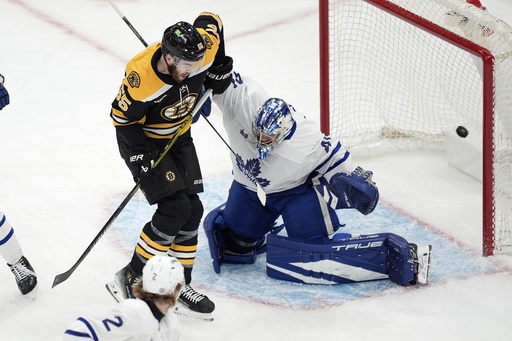 Marchand scores first goal of the season in overtime, leading Bruins to 4-3 victory against Maple Leafs