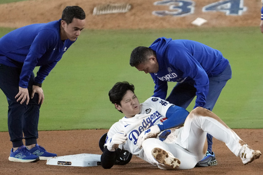 Shohei Ohtani sustains left arm injury while sliding into second base in Game 2 of the World Series; extent unknown