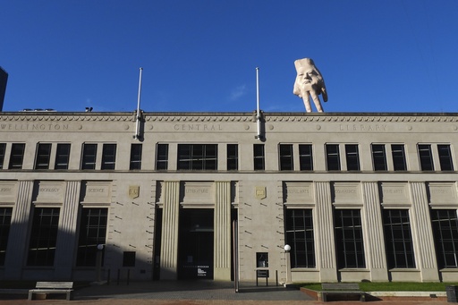 A beloved giant hand sculpture says farewell in a New Zealand city.