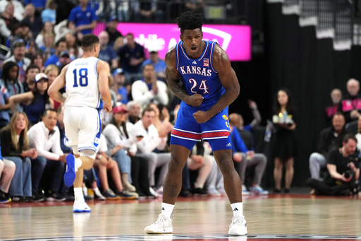 Top-ranked Kansas edges out No. 11 Duke 75-72 following Dickinson’s ejection in the Vegas Showdown