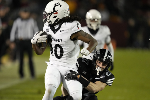 Rocco Becht passes for a touchdown and rushes for another in Iowa State’s 34-17 victory against Cincinnati.