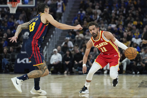 Andrew Wiggins nets 27 points while Stephen Curry contributes 23 in Warriors’ 120-97 victory over Hawks.