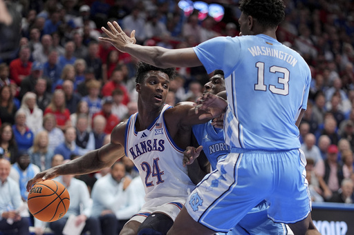 Top-ranked Kansas squanders 20-point lead in first half but manages to defeat No. 9 North Carolina 92-89