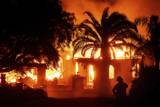 Strong winds intensify Southern California blaze, prompting mass evacuations.