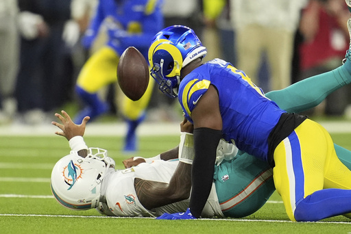 Tyreek Hill scores crucial touchdown as Dolphins defeat Rams 23-15, ending three-game losing streak.