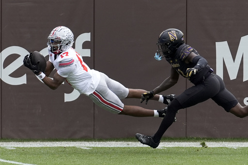 Carnell Tate, Ohio State wide receiver, records two touchdown receptions during his return to Chicago