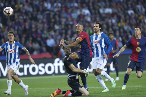 Dani Olmo guides Barcelona to victory in the local derby against Espanyol.