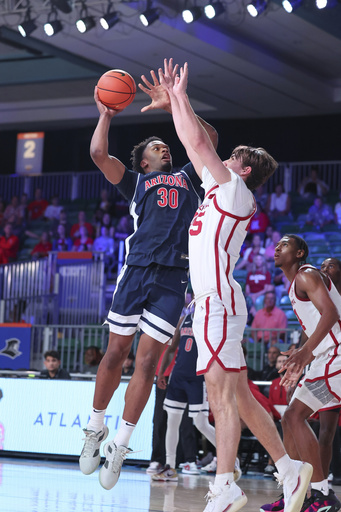 Moore and Fears score a combined 50 points, leading Oklahoma to victory over No. 24 Arizona in the Battle 4 Atlantis.