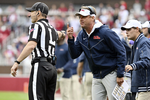 Dart throws for 515 yards and six TDs as No. 19 Ole Miss dominates Arkansas 63-31